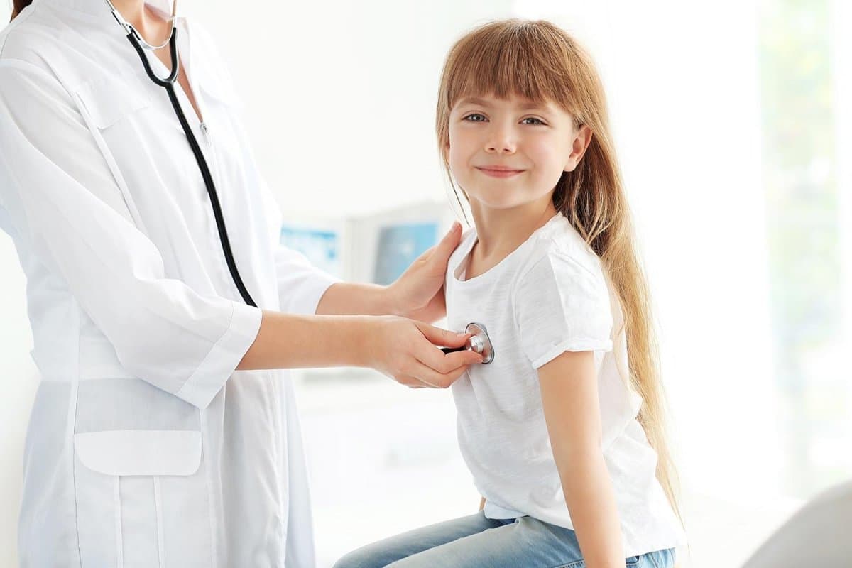 Doctor examining young patient